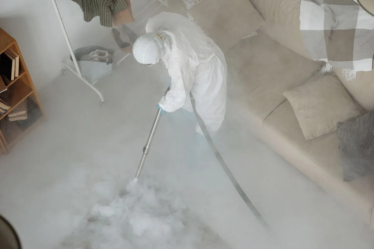 Biohazard cleanup technician in protective equipment, Kyle, TX